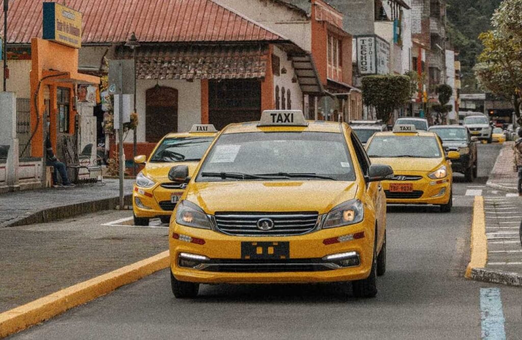 white and yellow Taxis