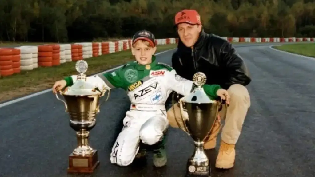 Michael Schumacher. presenting karting award to Sebastian Vettel